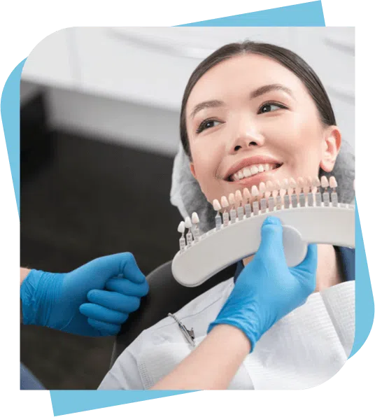woman having the colour of her teeth matched for a new dental crown