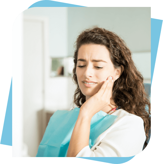 woman massaging her jaw because of pain.