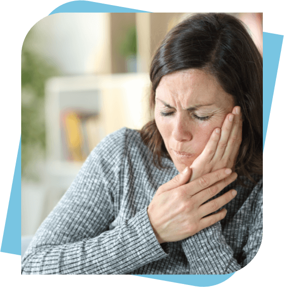 woman holding her cheek because of tooth pain.