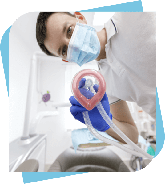 dentist holding a nitrous oxide mask