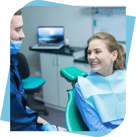 woman smiles at her dentist after a dental appointment