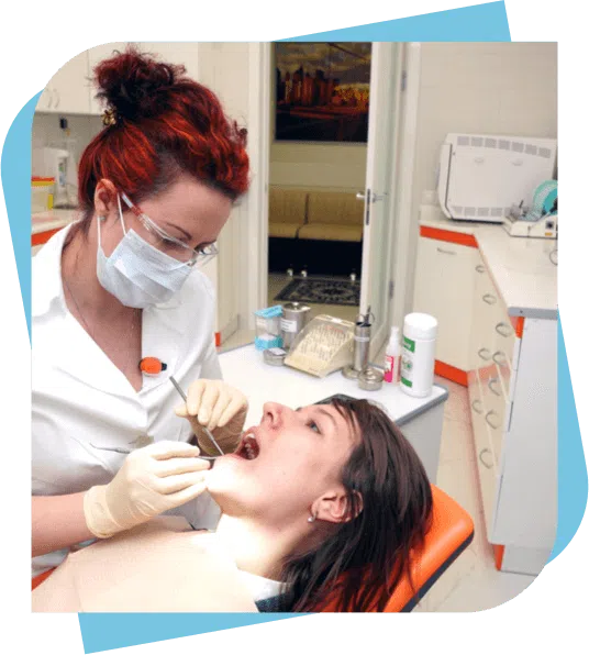 Female dentist performing a procedure on a sedated patient.