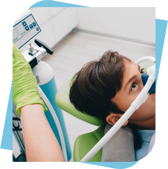 Teenage boy receiving nitrous oxide sedation in a dental chair.