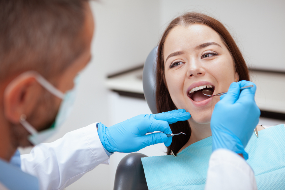 woman gets dental checkup