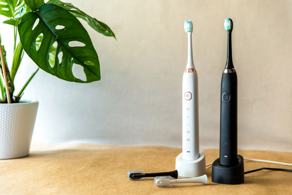 two electric toothbrushes