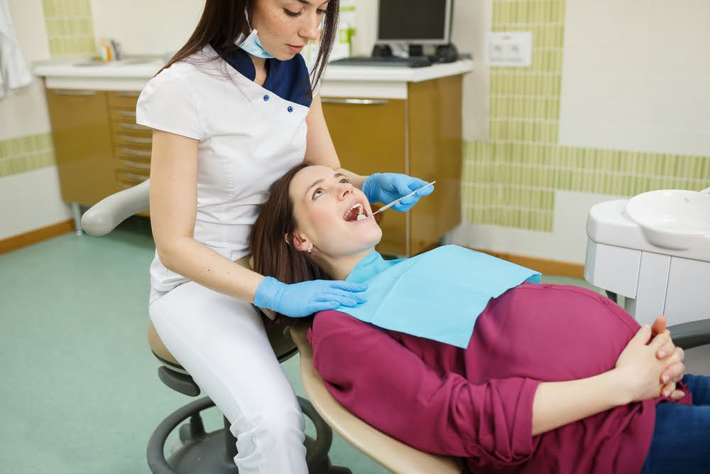 Pregnant woman having dentist appointment